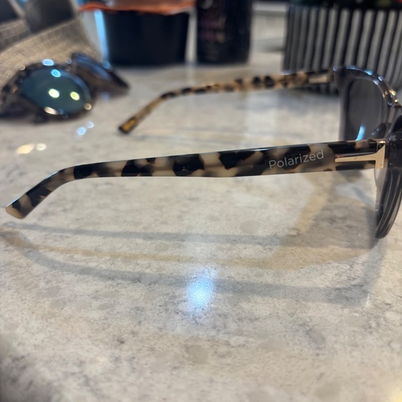 Ted Baker London polarized Sun glasses Translucent gray frame with Leopard arms